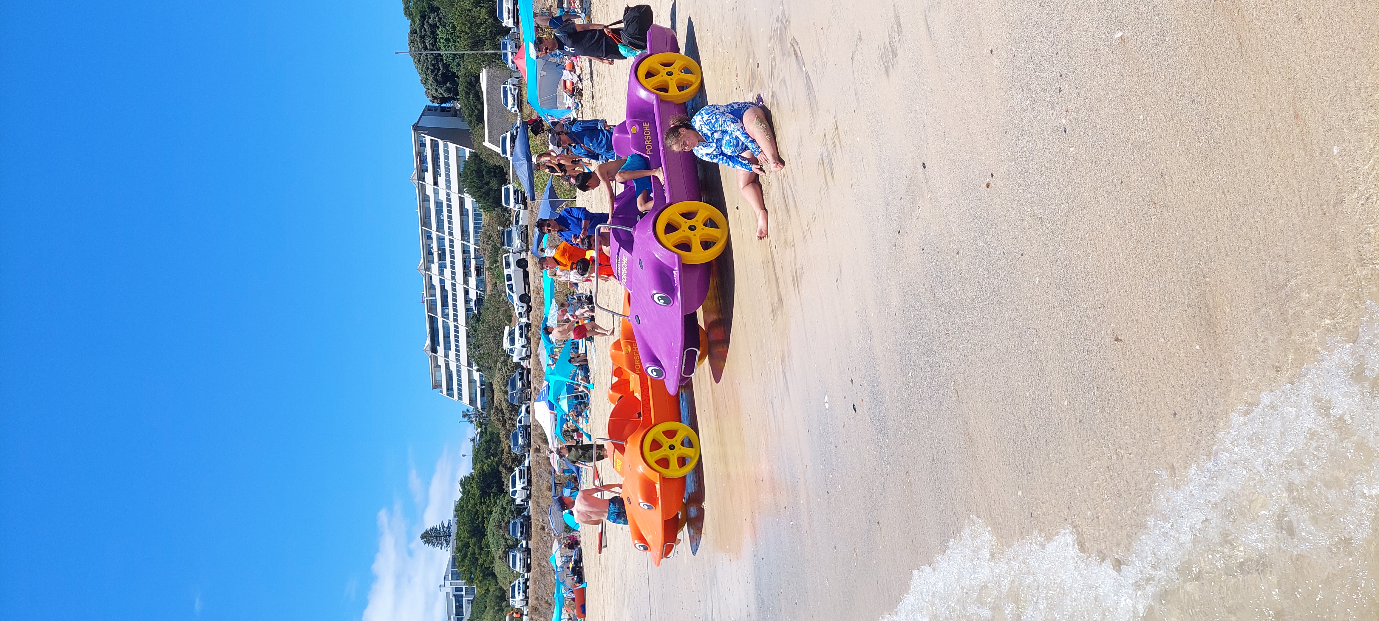 Colourful pedal boats on the beach